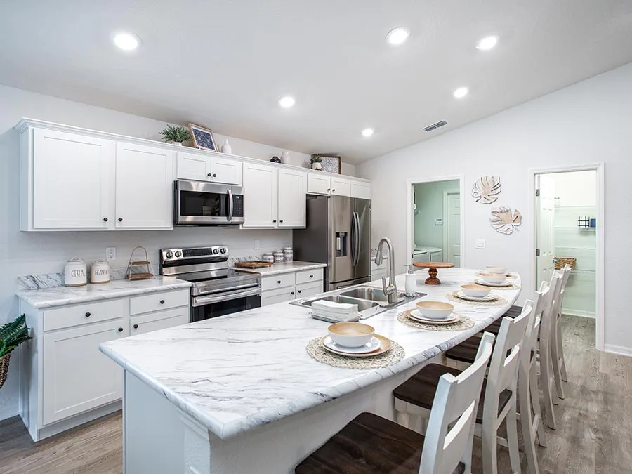 Wilsonart Calcutta Marble countertops with white kitchen cabinets